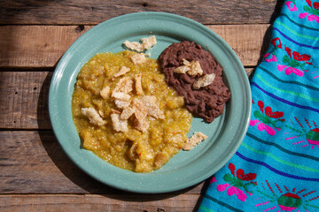 Mexican food; Chicharron with green sauce and refried beans