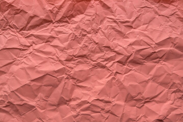 Peach color crumpled paper for background.