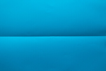Folded blue color paper for background.