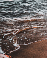 Fiery Farewell: Sun Dips Below Horizon in Dramatic Beach Sunset