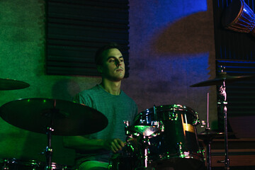 Obraz na płótnie Canvas Drummer Performing In A Live Concert