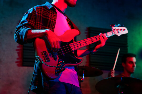 Bass Player In Stage With Colorful Lights