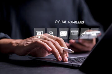 Digital marketing  Person use laptop with displays digital marketing icon for digital marketing commerce online sale concept, website ad, email, social network, video, SEO and business strategy.