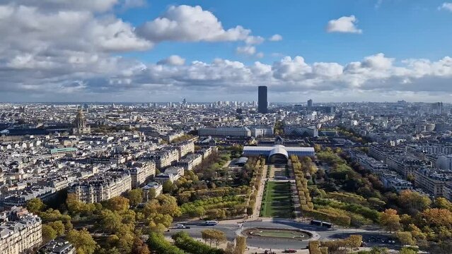 Scenery view from the Eiffel tower height to the Paris cityscape, France. Montparnasse tower and Les Invalides seen on the horizon