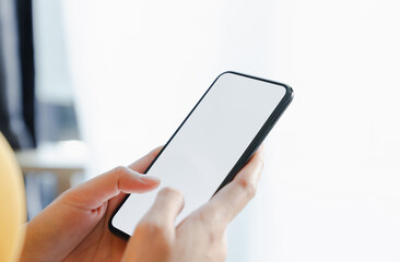 Hand holding smartphone mockup of blank screen, Take your screen to put on advertising.