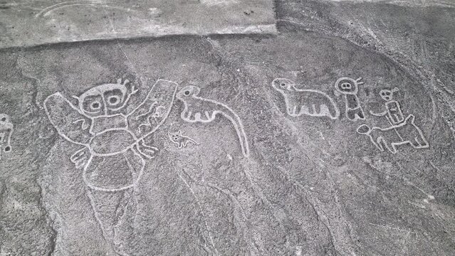 Aerial view of the mysterious humanoid creatures in Nazca desert, Peru. 