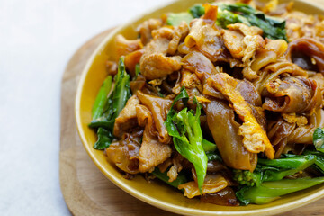 Stir-fried rice noodles with soy sauce and pork