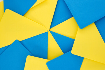 Blue and yellow envelopes organized in symmetrical pattern