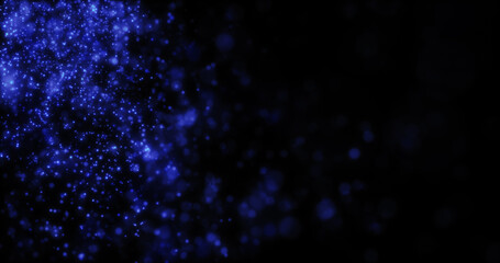 Blurred blue abstract background of bokeh and small round particles of energy magical holiday flying dots on a black background
