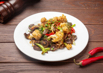 Beef meat with broccoli cabbage. On a wooden background.