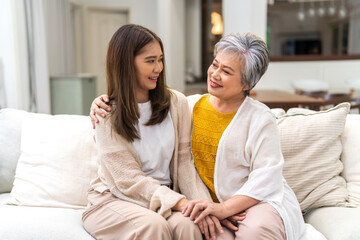 Obraz na płótnie Canvas Portrait of enjoy happy love asian family senior mature mother and young daughter smiling play laughing and having fun together at home, care, elderly, insurance.happy family and Mother Day concept