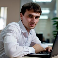 man working on laptop.  A professional white person with a computer. A man uses a laptop. 