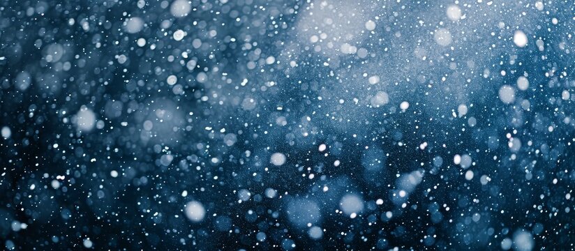 High quality photograph of snowfall on a dark backdrop.
