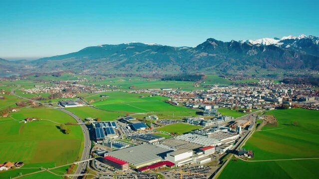 Panorama Aerial View Of Bulle Town And Industrial Site In Canton Of Fribourg, Switzerland.