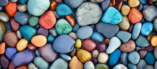Photo sur Aluminium Pierres dans le sable Vibrant Beachscape: Colors of Colorful Pebbles on Pebbles-Strewn Beach