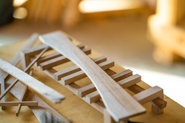 Small wooden parts for handmade crafts in a carpentry workshop, close-up