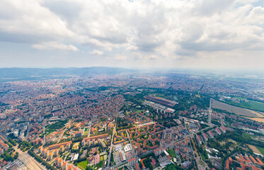 Fototapeta premium Turin, Italy. Panorama of the city in summer. Industrial and residential areas. Fields. Aerial view