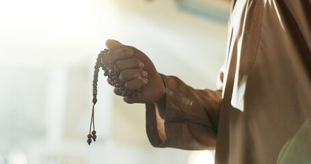 Prayer, beads and hand of muslim man in mosque, temple or Islam worship of Allah in spiritual,...