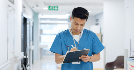 Doctor, planning and writing in documents, medical checklist or charts for hospital notes or clinic service. Healthcare worker, asian man or nurse smile for clipboard, paperwork or thinking in clinic - Powered by Adobe