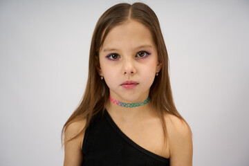 Cute girl portrait on a white background, close-up