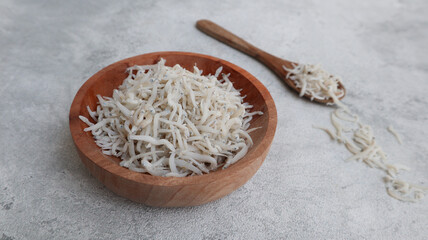 Teri Medan. Teri Tauge Medan. Medan anchovy over gray background. This type of medium-sized anchovies is white and quite popular in Indonesia.