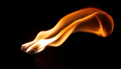 A dynamic fire flame dancing in the air against a dark backdrop, ideal for illustrating concepts of energy, passion, or the ephemeral nature of life.