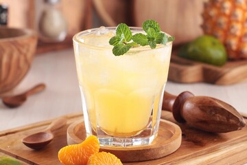 fresh orange juice with ice cubes