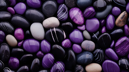 Obraz na płótnie Canvas background of purple, gray and black pebbles of different shapes and textures with patterns