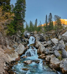 Cascading waterfall in the mountains. Kara-Kamysh, Kyrgyzstan 