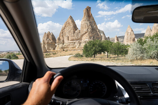 Driver seat view over the Cappadocian cave town and fairy chimneys close to Goreme, Turkey.