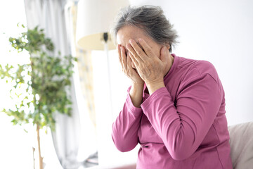 Depressed asian senior woman with depression,anxiety,depressive , old elderly patient crying alone at home - obrazy, fototapety, plakaty