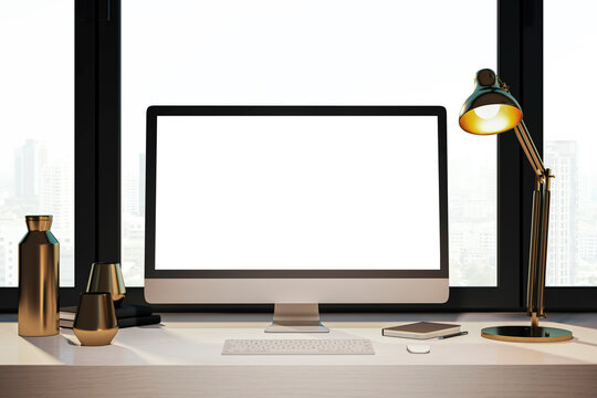 Clean designer desktop with empty white computer monitor, lamp, supplies and other items. Window with city view in the background. Mock up, 3D Rendering.