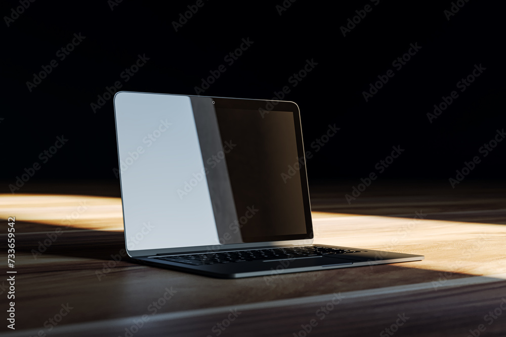 Poster laptop with dark screen on wooden floor, light shaft highlighting the device. tech mockup. 3d render