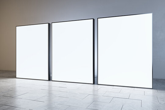 Contemporary light gallery interior with blank white mock up banners. Museums and exhibition concept. 3D Rendering.