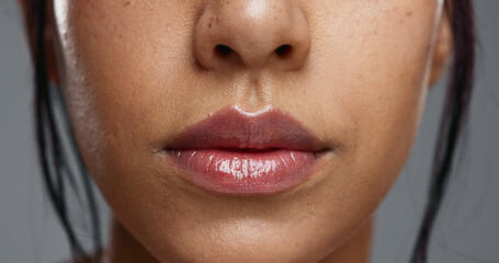 Woman, mouth and closeup in studio for dental wellness, beauty and change with cosmetics by...