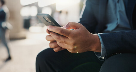 Hands, phone and closeup of businessman in the city networking on social media, mobile app or internet. Technology, typing and professional male person on website with cellphone in urban town.