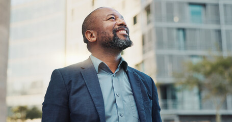 Naklejka premium Business man, smile and city with entrepreneur, smile and happy from morning commute and travel. Confidence, view and urban building with an African male professional ready for working at a job