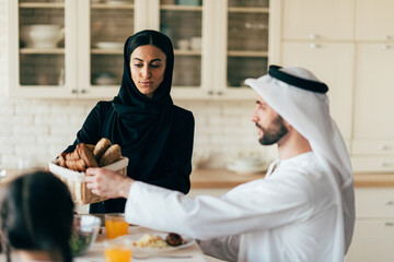 Traditional arabian family from Dubai spending time together at home - 733665705
