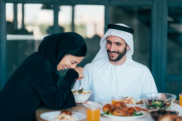 Traditional arabian family from Dubai spending time together at home - 733665722