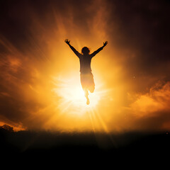 Silhouette of a person jumping against the sun.