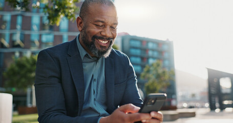 Smile, phone and African businessman in the city networking on social media, mobile app or...