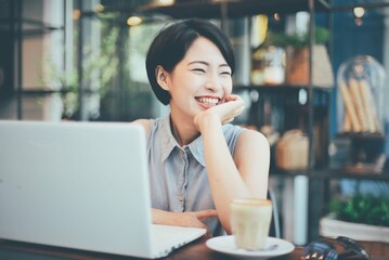 Woman Smiling With Coffee Laptop