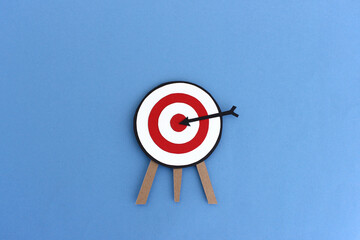 Paper target with arrow in center