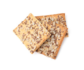 Cereal crackers with flax, sunflower and sesame seeds isolated on white, above view