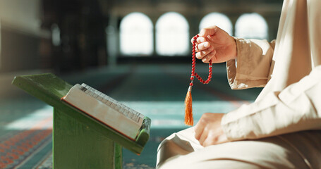 Islam, prayer beads and man in mosque with Quran, mindfulness and gratitude in faith. Worship, religion and Muslim scholar in holy temple for praise with book, spiritual teaching and peace meditation