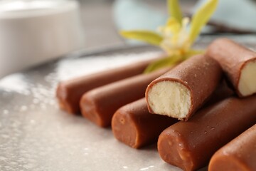 Glazed curd cheese bars on plate, closeup