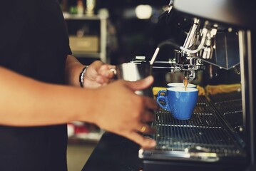 Fototapeta na wymiar Man Serving Cup Coffee