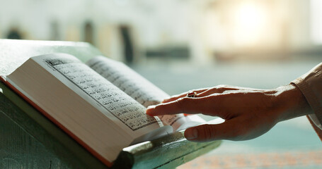 Hands, Quran and closeup of woman reading in mosque for religion study, faith or worship....
