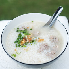 Close up of soft-boiled rice in bowl.