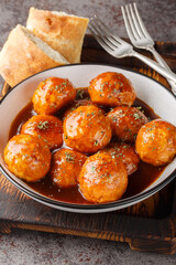 Chipotle Honey Meatballs are the perfect sweet and spicy Mexican appetizer closeup on the bowl on the table. Vertical